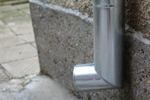 a close up of a metal object on a wall